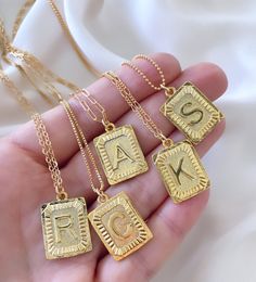 **Each piece in my shop, I personally create and photograph. (All photos are property of The Cord Gallery LLC) Thank you for supporting my small business. Gold Square Letter Medallion Pendant Necklace This stunning Initial Necklace adds a vintage and modern touch to anything you wear it with! Features a 24k gold plated square Medallion Letter Pendant with lots of texture, interest and sheen. Each charm hangs on your choice of chain in the length of your choosing. {Pendants are 1 inch tall (inclu Letter Charm Necklace, Initial Necklaces, Gold Letter Necklace, Gold Medallion, Letter Pendant Necklace, Initial Necklace Gold, Letter Charm, Initial Pendant Necklace, Medallion Necklace