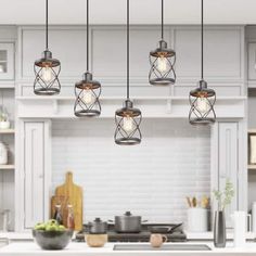 an image of a kitchen setting with lights hanging from the ceiling and pots on the counter