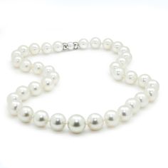 Description: This lovely 19" princess-length necklace strand has 37 round cultured South Sea pearls brought together by another pearl and an 18-karat white gold clasp. They are beautifully matched in color and luster. They graduate in size from 10mm to 14mm down to the center, and the clasp is made of 18kt white gold and a pearl for the clasp to insert into for a seamless transition. This pearl necklace strand is prominent, projecting elegance and natural beauty. These are pre-owned and in Like New condition. Specs: Material info: Solid 18Kt (750) White Gold Clasp with Pearl for InsertTotal Gram Weight: 89.9 Grams Pearl Information: 37 Round Cultured South Sea PearlsColor: White with Pink OvertonesShape: RoundLuster: Medium to HighGrade: A to AASize: 10.00mm Graduates Up to 14.00mm Marking Luxury White Pearl Necklace With Sterling Silver Clasp, Fine Jewelry Single Strand White Pearl Necklace, White Pearl Necklace With High Luster For Anniversary, Formal White Gold Pearl Necklace With Sterling Silver Clasp, Luxury White Single Strand Pearl Necklace, White High Luster Pearl Necklace For Anniversary, Anniversary Pearl Necklace With High Luster Round Beads, Round High Luster Pearl Necklace For Anniversary, High Luster Round Pearl Necklace For Anniversary