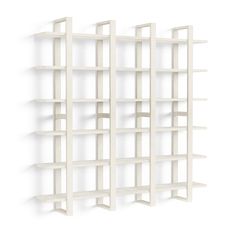 a white book shelf with four shelves on each side