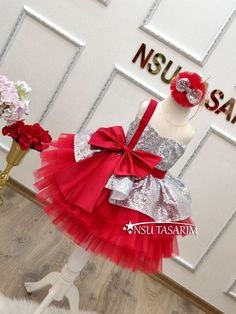 Christmas dress. Gift package. Baby girl dress. Holiday dress. Silver Sparkle Christmas dress.Elevate your little one's holiday celebrations with our enchanting Shimmering Scarlet baby dress. This delightful knee-length Christmas costume is designed to make her the star of the holiday season. With its stunning combination of bright red and shimmering silver, adorned with a large red bow on the bodice and a cascading red tulle skirt, it's the perfect choice for creating cherished holiday memories Elegant Christmas Princess Dress For Dress-up, Red Princess Dress For Holiday Celebrations, Red Ruffled Dress For Celebration, Princess Style Christmas Party Dress, Red Princess Dress For Holiday Party Season, Red Princess Dress For Birthday, Red Princess Dress For Party Season Festivities, Princess Style Holiday Dress, Princess Style Red Dress For Party Season