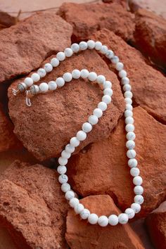 "Natural white buffalo howlite & sterling necklace. Made by native artisan. Gorgeous white buffalo beads (howlite) w/sterling hook and eye and native sterling bead at the end. -different sizes available 16\"-24\" -8mm beads -has native stamped sterling beads at the end Please note- the earrings in the picture match the necklace beautifully and are available to purchase separately. Here is a link to them- https://www.etsy.com/listing/667527971/mindfulness-gift-gemstone-earrings?ref=related-7 White Bead Necklace, Southwestern Necklace, White Beaded Necklaces, Inlay Jewelry, White Buffalo Turquoise, Lapis Pendant, Lapis Lazuli Pendant, Native American Turquoise, Sterling Necklaces