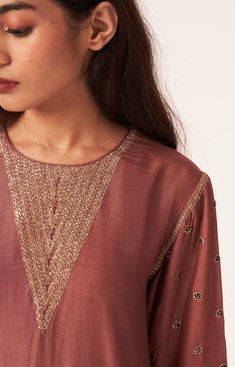 Editor's Note A Straight Cut Kurta Set Having Pita Embroidery On Neck And Sleeve Made In Fine Silk With Embroidered Palazzo Pants. Color: Brown Fabric: Cotton Silk Care: Dry Clean Only About The Designer DOT is an experimental take on structural weaving. The fabrics are handwoven by our artistry weavers. Our drapes are rightly tuned with everything to do with feminine flairs, pastel hues, dreamy silhouettes, and immense sophistication. The subtle embroidery, a hint of vintage with a clean and no Luxury Kurta With Embroidered Sleeves And Mandarin Collar, Luxury Straight Kurta Tunic With Resham Embroidery, Luxury Straight Kurta Set With Placement Embroidery, Luxury Embroidered Chanderi Churidar, Luxury Traditional Churidar With Straight Kurta, Unstitched Luxury Kurta With Gota Work, Luxury Long Sleeve Kurta With Embroidered Neckline, Luxury Silk Top With Resham Embroidery, Luxury Embroidered Raw Silk Traditional Wear