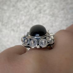 Black obsidian ring adjustable Sterling silver for women vintage style ring filigree handmade artisan ring for women made in Armenia ► Gemstone: Black obsidian ► RING SIZE: Adjustable sizes (choose from the option) ► RING WEIGHT: 16 gr ►Stone size: 24 mm * 13 mm All our jewelry is crafted with great attention to detail! We strive to provide you the best quality, modern design, and perfect look!! All our jewelry is made of high-quality sterling silver and is stamped with a 925 stamp ◦* ◦* ◦* ◦* ◦ Black Sterling Silver Filigree Ring As A Gift, Ornate Black Rings As Gift, Ornate Black Rings For Gift, Ornate Black Rings For Gifts, Black Filigree Ring With Intricate Design, Handmade Adjustable Elegant Filigree Ring, Handmade Adjustable Filigree Ring, Handmade Adjustable Ornate Filigree Ring, Elegant Handmade Adjustable Filigree Ring