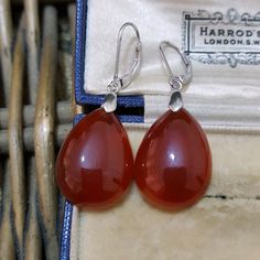 Impressive pair of sterling silver  earrings 4.3cm long, 1.5cm wide Leverback fastening Stunning Teardrop shaped natural red agate dangle 23.38ct in total Amazing terracotta colour, superb on Hallmarked 925 Excellent condition Weight 7.5gr ALL GEMSTONES HAVE BEEN PROFESSIONALLY TESTED. JEWELLERY BOXES ARE FOR DISPLAY ONLY. Elegant Silver Carnelian Earrings, Elegant Carnelian Drop Earrings, Elegant Carnelian Teardrop Earrings, Elegant Silver Agate Earrings, Elegant Teardrop Agate Earrings, Elegant Amber Agate Earrings, Carnelian Drop Earrings, Terracotta Colour, Red Agate