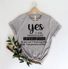 a t - shirt with the words yes i am pregnant and treeline on it