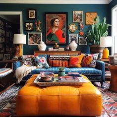 a living room filled with furniture and pictures on the wall above it's coffee table