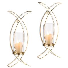 two wall sconces with candles in them on a white background, one is gold and the other is clear