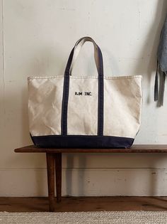 "Vintage LLBEAN canvas boat and tote bag.  Extra large (24\" wide) size with original monogram BJM INC. Nicely aged and lightly faded purple straps and bottom panel. Nice vintage patina with light age and use marks.  DIMENSIONS: 24\"W x 15\"H x 9\"D CONDITION:  very good vintage condition, strong and sturdy as it should be, with 2 single-layer holes in the bottom as shown (bottom layer only these do not go through!) The shop: http://www.etsy.com/shop/goseek" Vintage Cotton Canvas Bag With Large Capacity, Vintage Canvas Bag With Large Capacity, Vintage Canvas Bag With Double Handle For Daily Use, Vintage Style Large Capacity Canvas Bag, Vintage Double Handle Canvas Bag For Daily Use, Everyday Vintage Canvas Bag With Large Capacity, Vintage Canvas Travel Bag With Handles, Vintage Waxed Canvas Bag With Large Capacity, Vintage Large Capacity Canvas Tote Bag