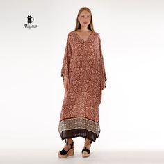 Introducing our stunning Brown Bat Wing Maxi Dress, a true statement piece for your wardrobe! This elegant long sleeve long dress is perfect for any occasion, whether you're dressing up for a special event or simply looking to add a touch of glamour to your everyday style. The unique bat wing design adds a fun and playful twist to this classic silhouette, making it a must-have piece for any fashion-forward individual. Elevate your look with this effortlessly chic and versatile dress that will tu Long Sleeve Boho Dress As Beach Cover-up For Spring, Bohemian Long Sleeve Dresses For Fall, Long Sleeve Boho Dress For Spring Beach Cover-up, Long Sleeve Brown Bohemian Boho Dress, Long Sleeve Maxi Dress For Vacation, Long Sleeve Brown Boho Dress For The Beach, Brown Long Sleeve Boho Dress For The Beach, Elegant Long Sleeve Dress For Beach Cover-up, Brown Long Sleeve Boho Dress