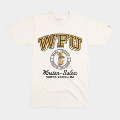 Calling back to vintage, mid-20th century Wake Forest pennants, we adapted this retro block “WFU” to design something with that era in mind. The addition of their location in Winston-Salem is a nod to Wake Forest’s midcentury move in 1946, along with this retro-inspired crest. Products are mocked up on a size S. Graphics may appear smaller on larger sizes. Vintage College T-shirt With Lettering, Vintage Embroidered College Top, Vintage Embroidered Graphics Top, Vintage Embroidered Graphic Top For College, Vintage Embroidered Tops For College, Vintage T-shirt With Lettering For College, Vintage Lettering T-shirt For College, Vintage White Tops With Embroidered Graphics, Vintage White T-shirt For Fan Gear