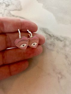 this listing is for one pair of hypoallergenic dainty dangle earrings. The posts are sterling silver. Enamel hearts and evil eye charms make up these lovely earrings. Pink Evil Eye, Dainty Dangle Earrings, Heart Dangle Earrings, Evil Eye Charm, Lovely Earrings, Silver Enamel, Evil Eye, Dangle Earrings, Make Up