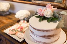 a white cake sitting on top of a wooden table