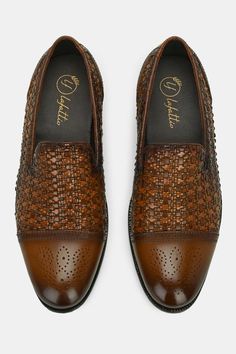 Tan loafers with brogue pattern, basket weave detailing in front and round toe detailing.
Composition: Leather
Color: Brown
Other Details: 
Handcrafted
Round toe
Heel Height (in inch): 0.75
Weight (in gms): 400 - Aza Fashions Brown Leather Shoes With Perforated Toe For Business Casual, Business Loafers With Woven Leather And Round Toe, Business Woven Leather Loafers With Round Toe, Formal Slip-ons With Woven Sole, Formal Brown Loafers With Perforated Toe Box, Formal Brown Moccasins With Woven Sole, Brown Business Loafers With Woven Sole, Formal Brown Loafers With Woven Sole, Business Leather Loafers With Woven Detail