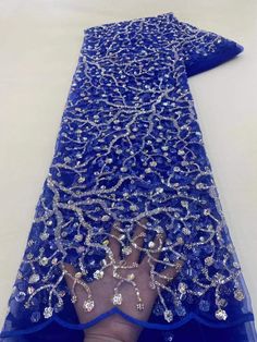 This high quality Fabric is measured in 5 Yards With Embroidered Beading and Sequin. It is soft, very delicate and beautiful. This high Quality Fabric is made with Fashion embroidered rhinestones can be used in making party wedding dresses, skirts, shawls, scarves and other other fashion apparels as you would like. Size : Length : 5 yards (180 inch). Width: 50 inch (Please allow slight deviation for the measurement data ,±1 inch) Material: 100% Polyester, Tulle Lace Fabric, Eco-Friendly embroide Blue Organza Embroidered Fabric For Party, Fitted Embellished Embroidered Fabric For Party, Beaded Organza Embroidered Fabric For Party, Festive Lace Sequin Fabric With Rhinestones, Elegant Organza Embroidered Fabric For Banquets, Fitted Embroidered Fabric With Rhinestones For Evening, Party Sequin Lace Fabric With Rhinestones, Elegant Embroidered Sequin Fabric For Banquet, Elegant Rhinestone Embroidered Fabric For Banquet