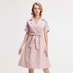 A safe bet in any wardrobe, the trench dress is available here with a tailored collar and wide flaps on the shoulders that give character to the silhouette. Adorned with refined metal buttons, generously flared, this timeless piece is cut from a breathable poplin slightly stretch. To feminize with heels or to wear with sneakers for a more casual and current look. Main fabric:  62% Cotton 35% Nylon 3% Elastane Machine wash gentle cycle (30 degrees max) Semi-formal Dress With Lapel Collar And Button Closure, Elegant A-line Shirt Dress With Button Closure, Spring A-line Single Breasted Dress, Chic A-line Blazer Dress For Spring, Midi-length Workwear Dresses With Covered Buttons, Midi Length Workwear Dresses With Covered Buttons, Workwear Midi Dress With Covered Buttons, Spring Collared Blazer Dress, Elegant Shirt Dress With Lapel Collar For Work