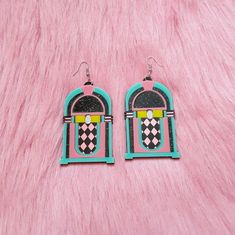 "Thanks so much for the rad pic @theheftyhideaway <3 These rad af Jukebox Earrings are super colorful, and are an awesome statement piece for any outfit! They were designed digitally by BC, then laser cut with many colors of 1/8 of an inch thick acrylic. The pendants were attached to a lightweight layer of 1/16\" black acrylic for extra durability while remaining lightweight. Each pendant was then added securely to a silver hypoallergenic earring hook. From top of earring post to bottom of pe Adjustable Nickel-free Retro Earrings, Retro Adjustable Pink Earrings, Handmade Retro Pink Earrings, Retro Rectangular Earrings For Gift, Retro Dangle Earrings Gift, Retro Dangle Earrings For Gift, Pink Retro Earrings For Gift, Retro Pink Earrings For Party, Retro Multicolor Earrings With Ear Wire