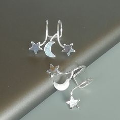 IMPORTANT **Please go through all the pictures i have posted for a listing with a ruler, on a model, on my hand, to get an exact idea of the actual size of the item.Sterling silver ear cuff and wrap earring.Comes with a crescent moon and stars. This listing is for ONE PAIR Size: 15 x 19 mm Stars: 5x 5mm Crescent moon: 6 x 5mm Weight: 0.90gm These earrings are made of real 925 hypoallergenic sterling silver. All my pieces are sent in a gift box. I can include a personal message from you if needed Silver Moon Shaped Cartilage Earrings, Silver Star-shaped Ear Cuff As Gift, Celestial Silver Nickel-free Cartilage Earrings, Silver Star-shaped Ear Cuff For Gift, Silver Star Shaped Ear Cuff Gift, Silver Star Shaped Ear Cuff As Gift, Silver Celestial Cartilage Earrings Nickel Free, Silver Moon Cartilage Earring, Silver Celestial Cartilage Earrings Nickel-free