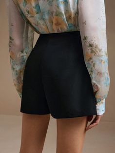 Step into summer with elegance and style with the Isabella Floral Print Asymmetric Hem Skort. This chic skort, in classic black, features beautiful floral embroidery that adds a touch of femininity and charm. The asymmetrical hemline enhances its unique design, making it a standout piece in any wardrobe. Perfect for casual outings or dressed up for a more formal occasion, this skort is versatile and stylish. SIZE + FIT Model is wearing: S (US4) Size: 171.0 / 67.3 Chest size: 89.0 / 35 Waist size Floral Wedding Dress, Jupe Short, Black Embroidery, Black Features, Summer Black, Chest Size, Asymmetric Hem, Waist Size, Formal Occasion