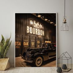 an old black car is parked in front of a sign that says beam bourron