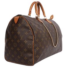 Authentic, pre-loved classic Louis Vuitton brown Speedy 40 handbag tote. Features monogram canvas, double rolled handles, zip-top closure, brown textile lining with slip pocket. Perfect bag for the day, evening, and traveling use. I added a non-LV heavy-gauge shoulder strap to use as a shoulder crossbody bag. Authenticity date code: MB0050 Strap drop: 22" Non LV Brown Monogram Canvas Bag With Large Capacity, Travel Satchel In Monogram Canvas With Large Capacity, Travel Satchel With Large Capacity In Monogram Canvas, Everyday Luxury Monogram Canvas Bag With Handle Drop, Travel Satchel In Monogram Canvas, Monogram Canvas Satchel Tote For Travel, Monogram Canvas Satchel For Travel, Monogram Canvas Travel Bag For Daily Use, Designer Brown Travel Bag With Large Capacity