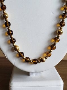 This is a vintage Napier, gold tone metal beads and glass beads necklace. There is a bit of the chain that doesn't have beads on it, as you can see in images. The beads can move on the necklace, slightly. This measures 25.25 inches across. Don't forget to stop in at my other Etsy shop... http://www.etsy.com/shop/xtdesigns. Follow me on Twitter at... MyYiayiaHadThat@MyYiayiaHadThat. If you have a wish list or are looking for something specific, please ask. I may have exactly what you are looking Gold Metal Necklace With Polished Beads, Gold Necklace With Polished Metal Beads, Vintage Polished Gold Beads, Vintage Necklace With Polished Beads, Vintage Gold Polished Beads, Vintage Czech Glass Necklaces With Polished Beads, Costume Jewelry Necklaces With Round Beaded Chain, Vintage Czech Glass Necklace With Polished Beads, Vintage Czech Glass Polished Beads Necklace