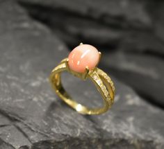 Coral Ring set with a Natural Angel Skin Coral in the highest grade, natural patterns & pale pink color, from Italy, at 10x8mm, 3 Carats. Together with small CZ Diamonds on the band. Natural Coral Ring made of Solid 925 Sterling Silver ☞ made to last. **The ring is plated with 18K Gold (the thickest plating - 3 Micron) over Solid 925 Sterling Silver. Matching Earrings: www.etsy.com/uk/listing/763926083 Matching Pendant - please ask me March Birthstone - Genuine & Natural Stone ❀ ❀ Each Natural G Engagement Ring Gold Vintage, Gold Vintage Ring, Engagement Ring Gold, Angel Skin, Coral Ring, Natural Coral, Coral Jewelry, March Birthstone, Citrine Ring