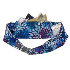 a blue and purple flowered neck gaiter with money sticking out of the top