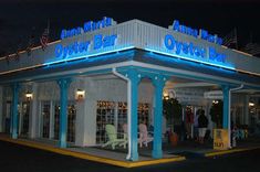 the outside of an oyster bar lit up at night