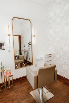 Two beige shampoo systems stand in front of a large wooden cabinet unit with green backsplash. Color Station Hair Salon, Moody Salon Suite, Hair Salon Decor Rustic, Salon Station Ideas Diy, Salon Suite Decor Small Spaces, Salon Station Ideas, Salon Studio Suite, Hair Suite, Hairstylist Aesthetic