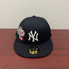 Brand - New Era Hat Model - 59fifty Hat Type - Fitted Hat Team - New York Yankees Design- Empire State Color - Navy Blue & White Sizes Available; 7, 7 1/4, 7 1/8, 7 3/4, 7 5/8 Blue Flat Cap For Baseball Season, Blue Flat Cap For Streetwear, Blue Flat Cap Fitted Hat For Streetwear, Blue Urban Hat With Flat Brim, Blue Urban Style Hat With Flat Brim, Blue Flat Brim Urban Hat, Custom New Era Hats, Hat New York, Yankee Hat