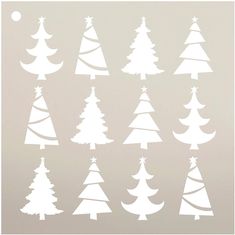 white christmas trees are shown against a gray background