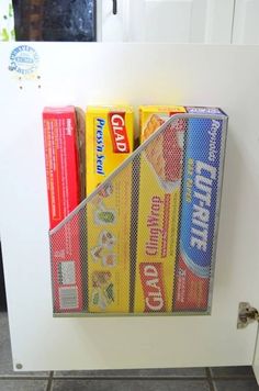 a white refrigerator freezer sitting inside of a kitchen next to a shelf filled with books