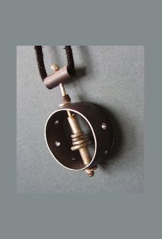 "This unique pendant is one of a kind with a unisex design. Modern, and contemporary style, handmade from sterling silver wire, forged silver, and pierced silver formed into a ring, oxidized black. Pendant measures approximately 1\" diameter, includes 18\" silver chain or leather cord. All jewelry is boxed and ready for gift giving. DETAILS: ~ Components are sterling silver  ~ Pendant measure approximately 1\" diameter ~ Ships at no extra charge. ~ Gift wrapping option available at checkout. Include your own special message in the card. ~ Handmade in Austin, Texas ❤️YOU MAY ALSO LIKE THESE ITEMS❤️ https://www.etsy.com/listing/72429573/radius?ref=shop_home_active_58&frs=1 https://www.etsy.com/listing/35670591/silver-domes-with-copper?ref=shop_home_active_53&frs=1 https://www.etsy.com/listin Minimalist Soldered Pendant Jewelry, Minimalist Hand Cast Jewelry With Round Pendant, Handmade Sterling Silver Contemporary Necklace, Hand Cast Modernist Jewelry For Gifts, Contemporary Sterling Silver Jewelry With Oxidized Finish, Modernist Hand Cast Jewelry As Gift, Modernist Hand-cast Jewelry For Gifts, Sterling Silver Pendant Necklace Electroformed, Hand Cast Adjustable Modern Jewelry