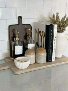 some bottles and spoons are sitting on a shelf