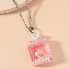 Bohemian Style Shell In Bottle Necklace! An Absolute Must Have For Summer Or For Any Beach Lover! Please See Pictures For Measurements! Cute Pink Necklace For The Beach, Cute Pink Necklace For Beach, Cute Pink Necklaces For Beach, Pink Bohemian Charm Necklace Gift, Bottle Necklace, Beach Lover, Beach Lovers, Resin Jewelry, See Pictures