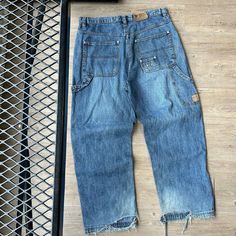 VINTAGE Y2K ' OutKast HipHop Workwear Baggy Denim Jeans Pants sz W36 L32 CONDITION : Wear and fading from age. No stains. Tears on lower back hems. Overall good condition/ wear ! These pants have been washed* - Please review pictures* TAGGED SIZE : ** Adult Mens W38 L33* ( Fits : Mens W36 L32 ) MEASUREMENTS : *Please see photos above for measurements. *Disclaimer: All measurements are in inches and are taken laying flat on the ground* * Waist measurement taken hip to hip * Length measurement tak Vintage Style Loose Fit Cargo Jeans For Streetwear, Vintage Baggy Cargo Jeans For Streetwear, Baggy Vintage Cargo Jeans For Streetwear, Vintage Wide Leg Cargo Jeans For Streetwear, Vintage Baggy Jeans With Pockets, Vintage Dark Wash Cargo Bottoms, Vintage Dark Wash Bottoms With Cargo Pockets, Vintage Baggy Cargo Jeans In Medium Wash, Vintage Medium Wash Bottoms With Cargo Pockets