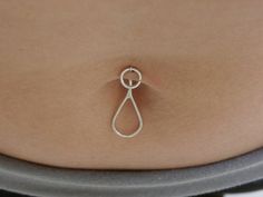 Please measure the thick of your piercing before ordering: If you feel this style will be too small contact me for a custom size inquiry. For help on finding your own customized size tailored to your needs, I've added a tutorial listing to make it easier since everyone has different piercing thicknesses. Please visit my link https://www.etsy.com/listing/233647856/tutorial-on-determining-size-999-fine?ref=shop_home_active_1 A unique and original design; this belly button barbell is made with your Piercings Belly, Minimal Contemporary, Barbell Piercing, Belly Jewelry, Navel Piercing, Belly Rings, Nose Piercing, Rings Simple, Handmade Design