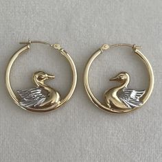 Rare, unique, vintage solid 14K yellow and white gold swan bird hoop earrings.  Classic, puffy, 70s-80s gold figural animal hoops.  Marked 14K.  PLEASE NOTE Returns accepted within 7 days, but may be subjected to original shipping fee and any loss in value if an item isn't returned in original condition ✨. All jewelry listed is vintage/pre-loved and may have some *minor* wear commensurate with age throughout (but I do my best to note any flaws in the listing). Please note also that photographs g Gold Swan, Mid Century Modern Jewelry, Boho Birds, Dope Jewelry, Gold Hoop Earrings, Jewelry Earrings Hoops, Modern Jewelry, Estate Jewelry, Vintage Gold