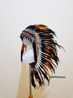 Black & Orange Feather Indian Headdress ReplicaThis Headdress is 100% handmade from feathers.* Head circumference: 59 centimeters / 23 inches* Length : MediumWHY US?* 100% Handmade and Eco Friendly Product* Finest Quality - Each item will go through a Quality Control process before shipping.* No Markup Price* Every purchase supports Balinese Artisans - All Artisans will keep on following their passions whileproviding for their families.SHIPPING* Estimated around 3-7 business days.* We provide tr Adjustable Black Costume Hats And Headpieces For Ceremonial, Adjustable Black Costume Hat For Ceremonial Occasions, Traditional Black Costume Hats And Headpieces, Black Bohemian Hat For Costumes, Black Bohemian Hat For Costume, Black Bohemian Costume Hat, Traditional Black Hat Bands For Festival, Traditional Black Costume Hats And Headpieces For Festivals, Traditional Black Costume Hats For Festivals