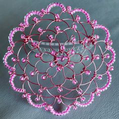 "Crafted from pink wire and pink lined beads, this kippah is a favorite with girls. It measures 4\" in diameter. It had a clear comb attached and arrives in an organza bag for safe keeping. Please contact me via \"Message to Seller\" for international shipping. Keepsake Kippot have been carried in many synagogue gift shops and Judaica stores throughout the country for over a decade. I am excited to make them available on Etsy! Please contact me if you are a shop buyer interested in a bulk purchase." Pink Beaded Craft Supplies For Gifts, Gift Shops, Pink Beaded, Organza Bags, Comb, Gift Shop, Beads, Pink, Gifts