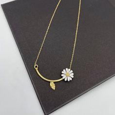 This is a lovely white daisy flower charm necklace.  Matching earrings are available in our shop for purchase. Measurements: Necklace length is 18" long plus 2" extender chain for adjustment.  Flower stem is 50 mm approx. Flower is 15 mm in diameter This necklace would be a PERFECT GIFT for you and your family and friends! Comes beautifully packaged in a gift box!   Click here to see more Modern Necklaces: https://www.etsy.com/shop/GrigorevaK?ref=seller-platform-mcnav&section_id=27366560 Thank y White Flower Pendant Necklace With Clavicle Chain, White Flower Clavicle Chain Necklace, White Flower Shaped Necklace With Adjustable Chain, White Flower Necklace With Adjustable Chain, White Flower Pendant Necklace With Birth Flower, White Flower Shaped Necklace With Flower Charm, White Flower Necklaces For Mother's Day, White Flower Pendant Necklace For Mother's Day, White Flower Necklace For Mother's Day