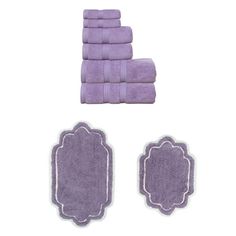 towels and bath mats are arranged in the shape of an ornate frame on a white background