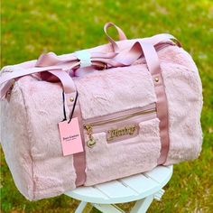 New Juicy Couture Fluffy Weekender Bag In Beautiful Dusty Blush Light Pink Color. Whether You Are Headed To A Romantic Getaway Or A Short Trip With Your Girls, Carrying The Juicy Couture Fluffy Weekender Bag Will Give You A Luxurious Feel. Crafted In Polyester, The Bag Showcases A Fluffy Exterior With A Pin-Mounted Logo And A Zippered Front Pouch Pocket And A Roomy Interior With A Front Wall Slip Pocket And A Zippered Back Pocket. It Is Topped With Dual Carry Handles And Comes With An Adjustable Luxury Shoulder Bag With Zipper Closure For Trips, Luxury Duffle Bag With Zipper Pocket For Trips, Luxury Duffle Bag With Zipper Closure For Travel, Luxury Women's Weekender Bag With Zipper Closure, Luxury Travel Bags With Zipper Closure, Luxury Bags For Weekend Trips, Luxury Travel Bag With Adjustable Strap For Trip, Luxury Women's Bags For Overnight Trips, Luxury Travel Accessories For Weekend Trips