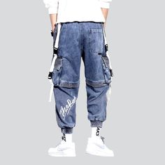 Make a bold statement with our 2023 Spring-Summer Collection's two-color men's denim pants. created with y2k-inspired. painted. baggy. high-waist. drawstrings closure and stretchy features. Ready to take your street style to the next level?Why It's Destined to Be Your New FavoriteThis one-of-a-kind denim pant is designed to make a statement. with a unique blend of y2k-inspired appeal. classic denim style. and modern details. Its striking two-color design. high waist. and baggy fit give it an und Spring Hip Hop Cargo Jeans In Denim, Spring Hip Hop Denim Cargo Jeans, Hip Hop Jeans For Spring Streetwear, Urban Blue Cargo Jeans For Summer, Urban Streetwear Bottoms For Summer, Spring Hip Hop Jeans For Streetwear, Spring Hip Hop Streetwear Jeans, Urban Summer Streetwear Bottoms, Summer Urban Streetwear Bottoms