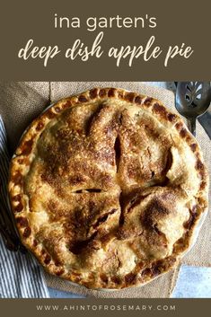 an apple pie sitting on top of a table next to a fork and knife with the words ina garten's deep dish apple pie