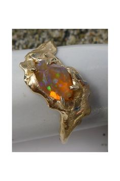 The Salt Marsh Shapeshifter Ring features an Ethiopian Opal, nestled a solid 14K gold band. Collectible Gold Opal Ring With Gemstone, Heirloom Gold Opal Ring With Polished Finish, Collectible Gold Opal Gemstone Ring, Collectible Opal Ring In 14k Gold, Unique Yellow Gold Opal Ring, Yellow Gold Opal Promise Ring With Polished Finish, Gold Opal Ring In 14k, Unique Gold Opal Ring In 14k, 14k Gold Opal Ring With Polished Finish For Promise