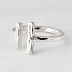 "Sterling Silver Bar Cuff Ring A simple, classy cuff ring featuring two vertical bars. A great minimalist look :) We package this lovely ring in a white gift box. This ring is handmade in our studio, the ring is slightly adjustable, due to the open band. Don't know your ring size? https://www.etsy.com/listing/126357720/fall-sale-ring-sizer-ring-size-ring Are you new to Etsy? Shop my store and add your favorite items from The Jewelry Girls to your cart. Most of my items can be made in your size o 14k Gold Ruby Ring, Silver Cuff Ring, Open Cuff Ring, Bubble Ring, Bar Ring, Cuff Ring, Cuff Rings, Ring Minimalist, Minimalist Ring