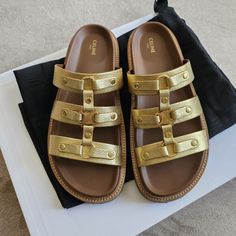 Celine Tippi Triomphe Slide Sandals Gold Metallic Leather Size: 37 Worn With Care Once For A Daytime Birthday Brunch & Has Been Stored Safely In It's Original Box Since Color: 35or Gold Line: Tippi Laminated Calf Skin Model: Triomphe Mule 30 Heel Height: Low (1-1.9 Inch) Insole: 10.5" Exterior Sole: 11.25" Specific Heel Height: 1.5" Sku: 352343093c.35or Made In Italy Retails For $990 Gold Sandals With Leather Lining For Summer, Chic Gold Sandals In Calf Leather, Chic Gold Calf Leather Sandals, Gold Open Toe Sandals With Leather Lining, Chic Gold Sandals With Leather Sole, Luxury Gold Leather Sandals, Designer Gold Sandals With Round Toe, Luxury Gold Calf Leather Sandals, Chic Gold Leather Sandals