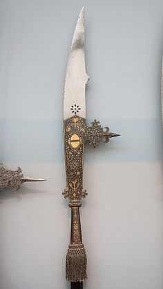 three different types of knives on display in a museum